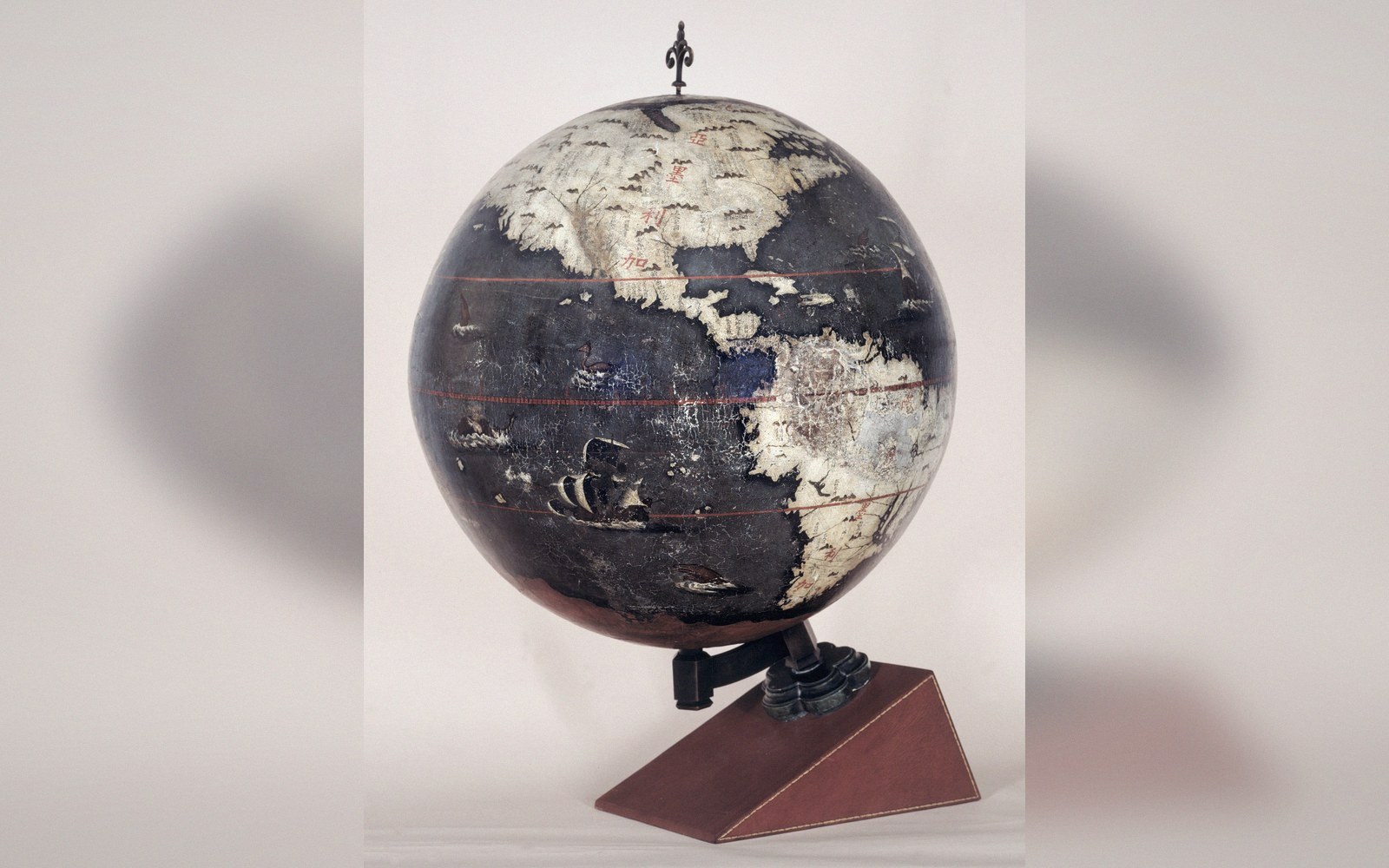 A globe beside a flat sheet showing the same continent