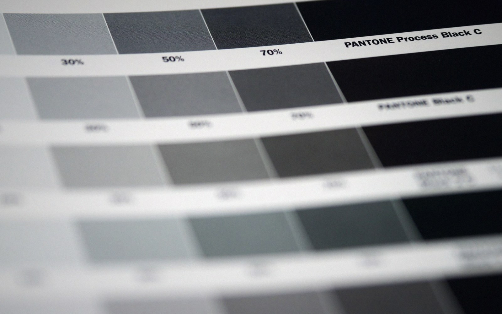 Pantone color swatch chart showing gray tint percentages leading to process black